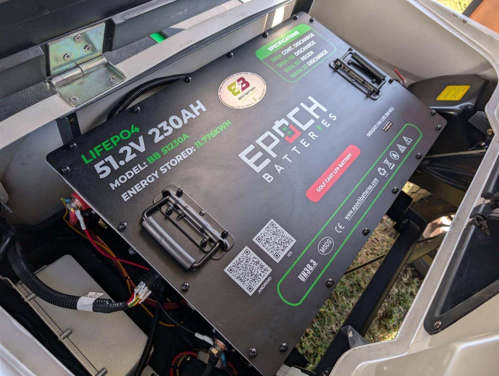 Epoch Big Box 48V 230Ah LiFePO4 golf cart battery under the lifted seat of a white golf cart