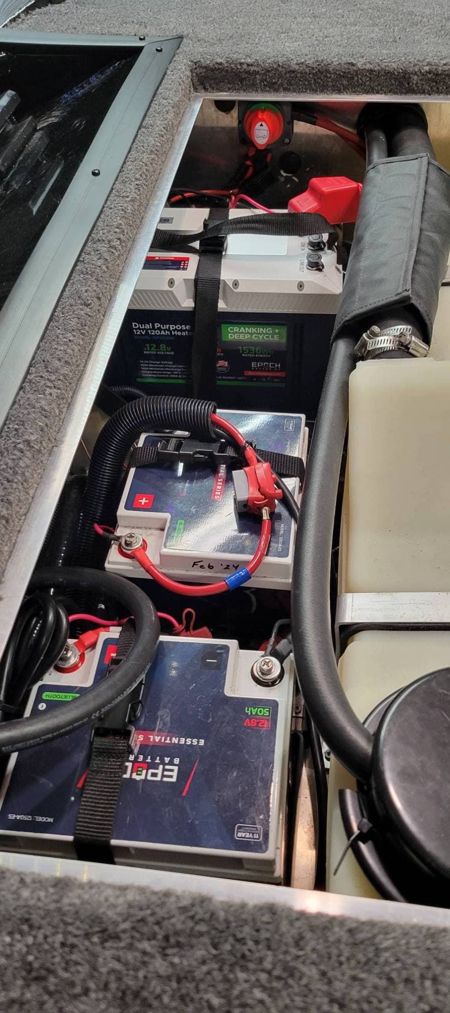 Epoch Dual Purpose 12V 120Ah heated cranking battery and two Essential Series 12V 50Ah batteries in a bass boat's battery compartment
